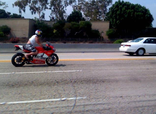 Motorcycle driver speeding while not wearing proper protective attire