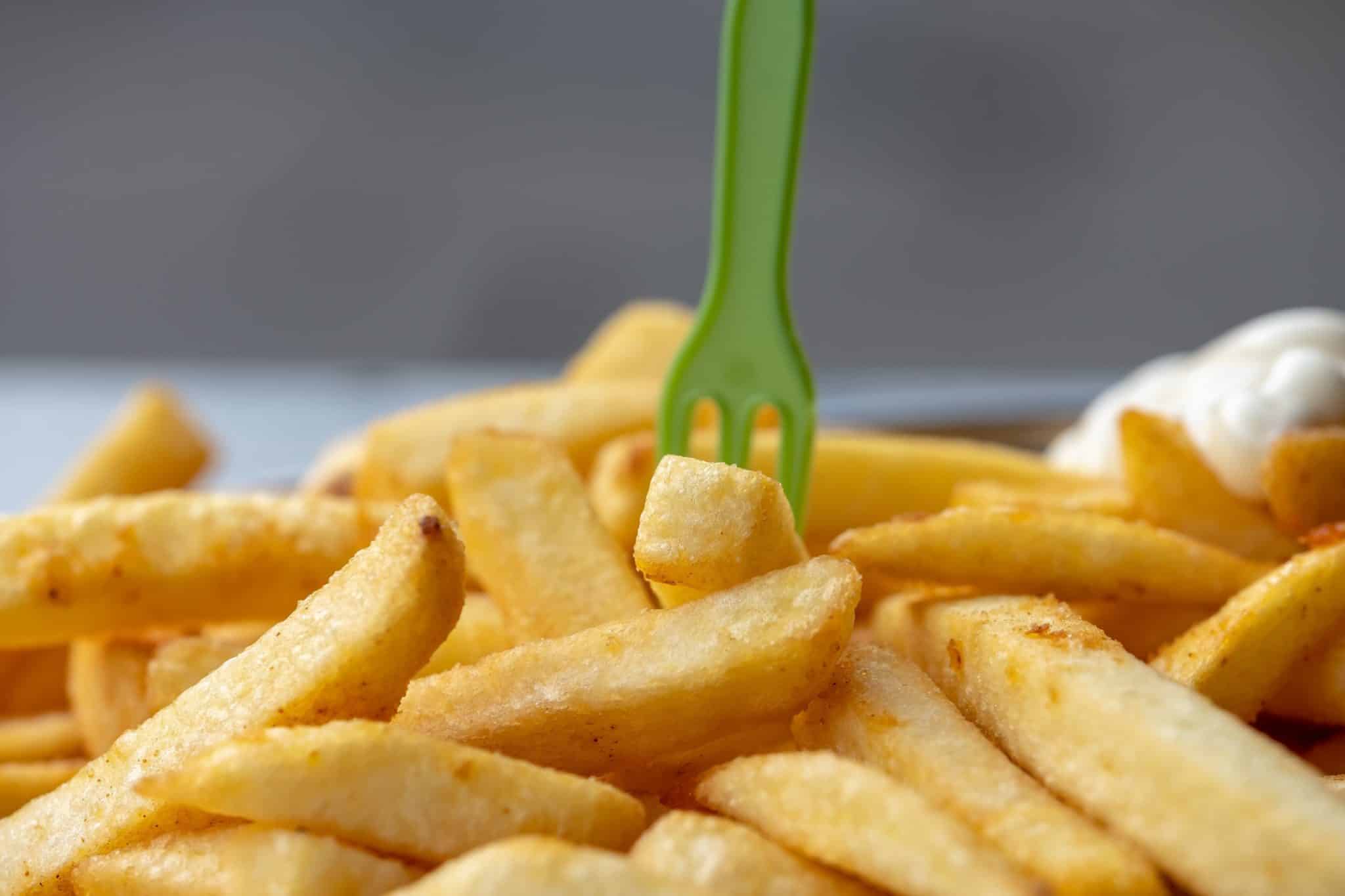 Close up of french fries on a plate