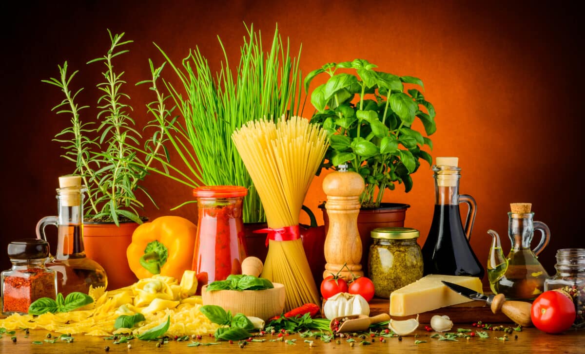 still life with traditional Italian pasta ingredients, herbs, vinegar and spices