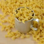 dry egg noodles with measuring cup