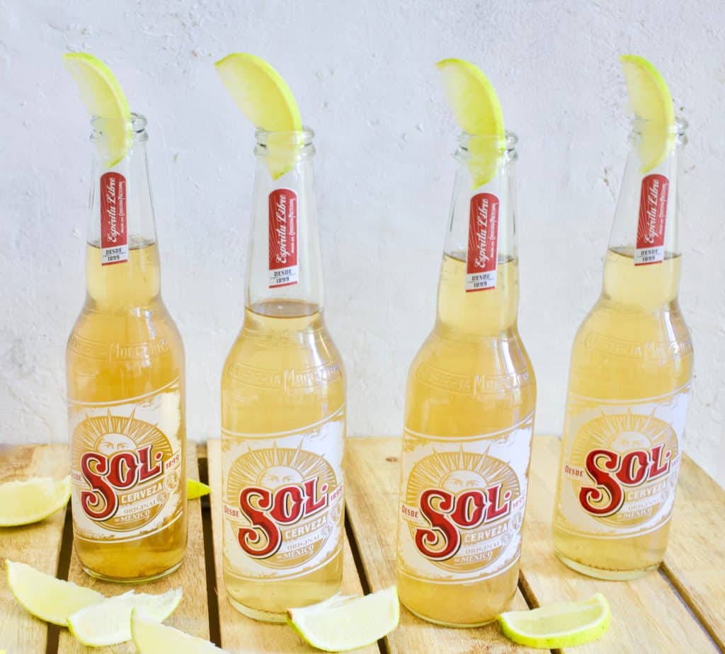 Sol Bottles of beer on a wooden table